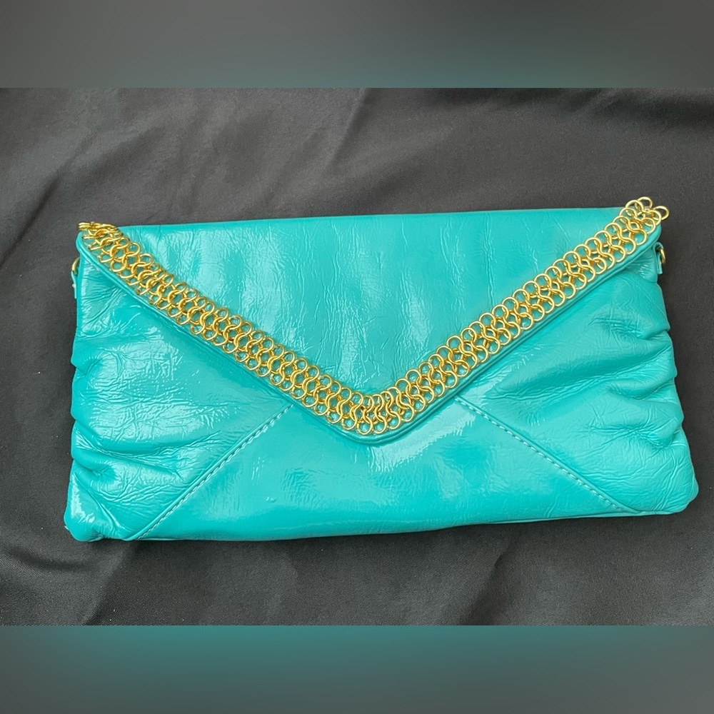 Melie Blanco Turquise and gold clutch! Good condition!